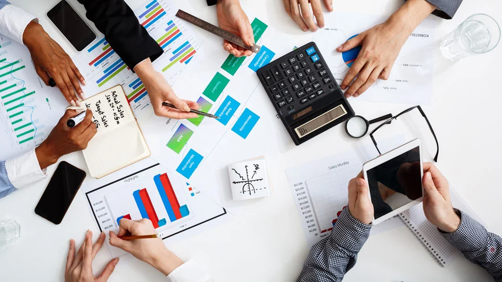 businessmen-hands-white-table-with-documents-drafts